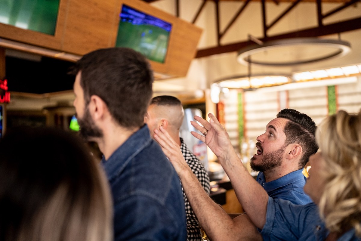 Friends watching match in a bar