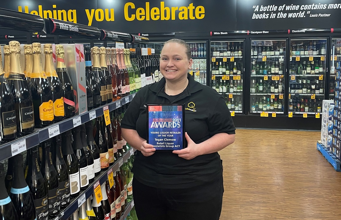 Young Liquor Retailer of the Year Tegan Clemow in store with her award