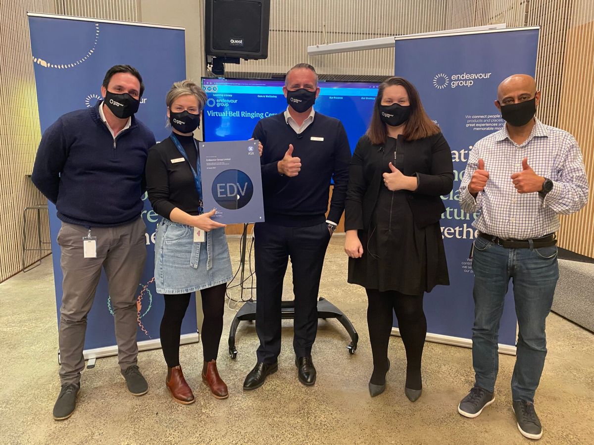 Endeavour Group lists on the ASX - staff in masks during virtual bell ringing ceremony for ASX listing