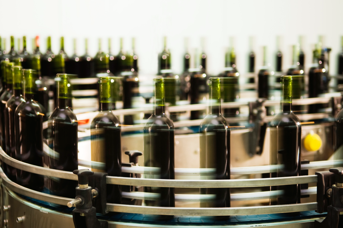wine bottles speeding around the production line, slightly blurred
