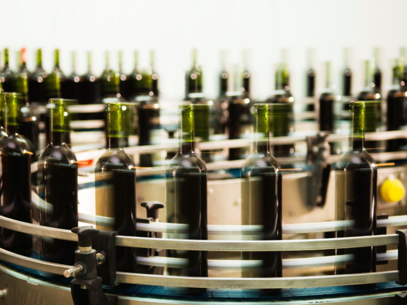 wine bottles speeding around the production line, slightly blurred