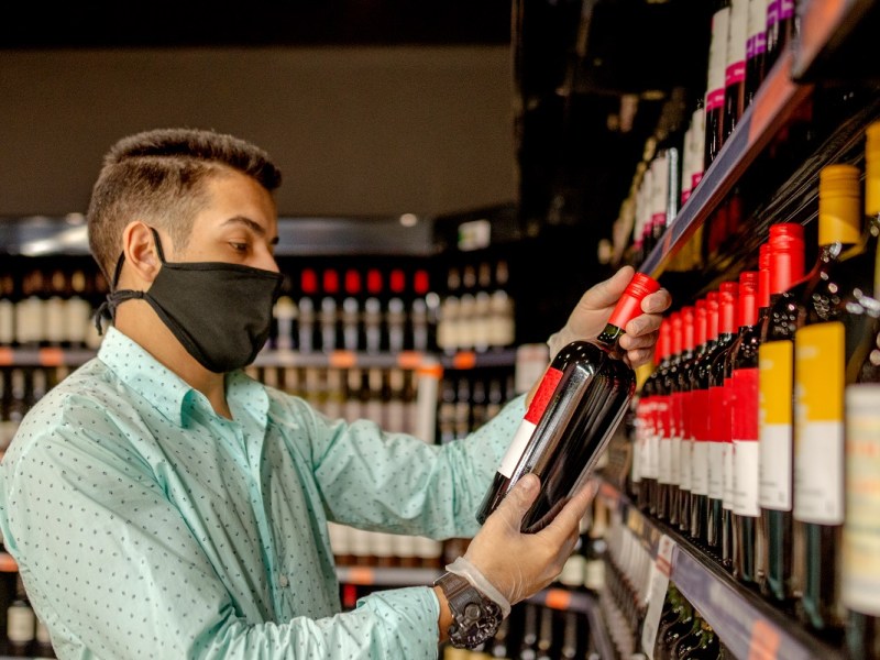 wine retailer with a face mask
