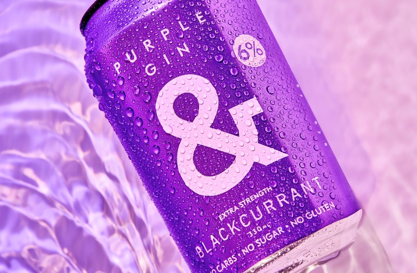 Styled product shot of Ampersand's new RTD Purple Gin Soda &